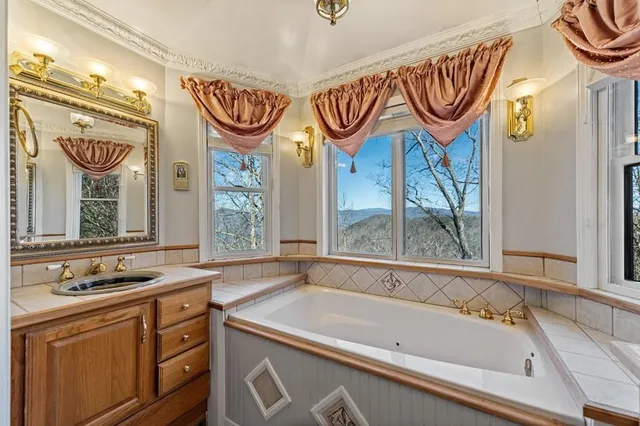 a view of a yard with wooden fence