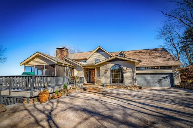 a view of front door of house with stairs