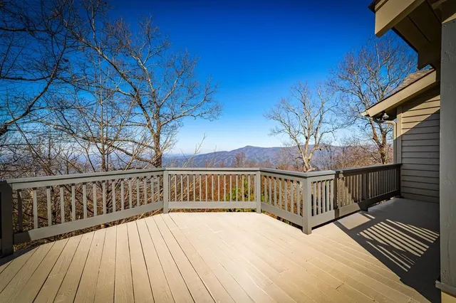 a living room with furniture a fireplace and wooden floor