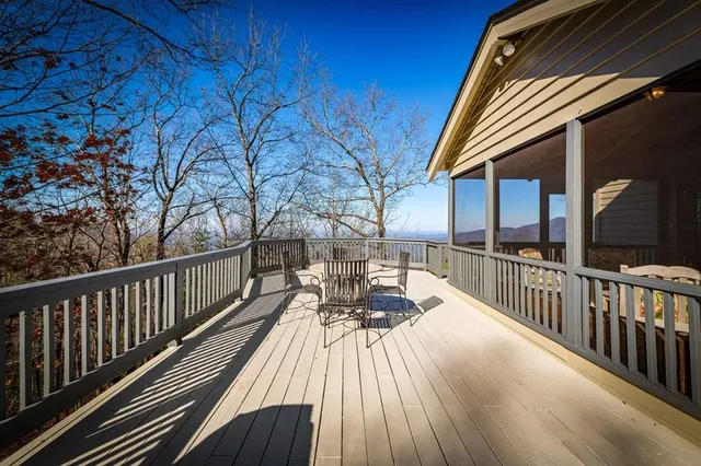 a living room with furniture a fireplace and a table