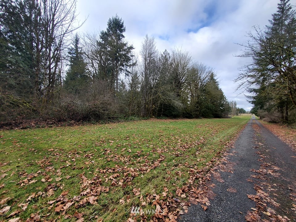 369 Hart Road, Unit 38 Winlock, WA 98596 - Photo 12 of 33 a view of a garden with large trees