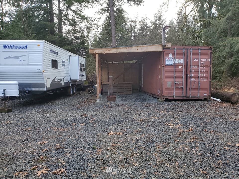369 Hart Road, Unit 38 Winlock, WA 98596 - Photo 6 of 33 a view of a house with a backyard and trees