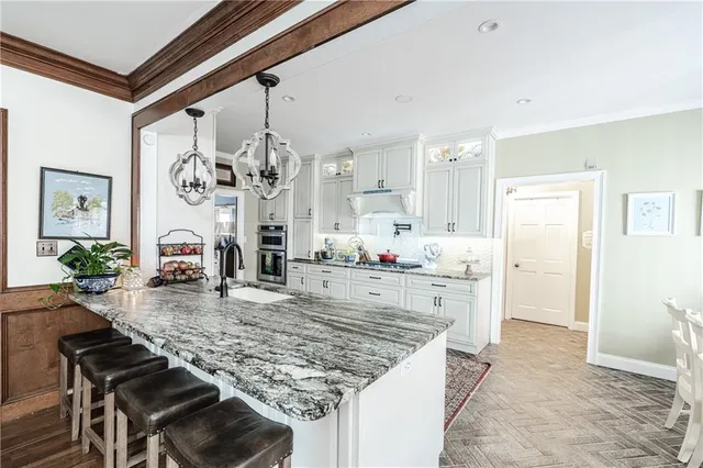 a living room with fireplace furniture and a large window