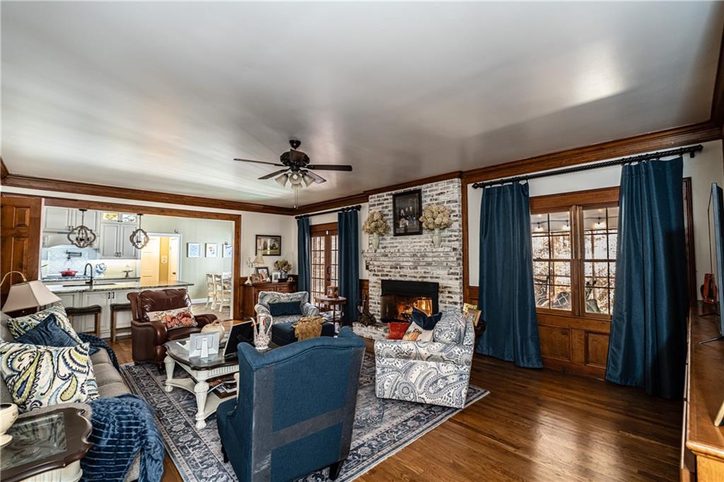 36 Saddle Mountain Road Southeast Rome, GA 30161 - Photo 16 of 42 a living room with furniture large window and a fireplace