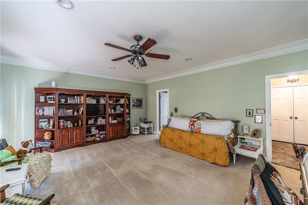 36 Saddle Mountain Road Southeast Rome, GA 30161 - Photo 23 of 42 a living room with furniture and gym equipment