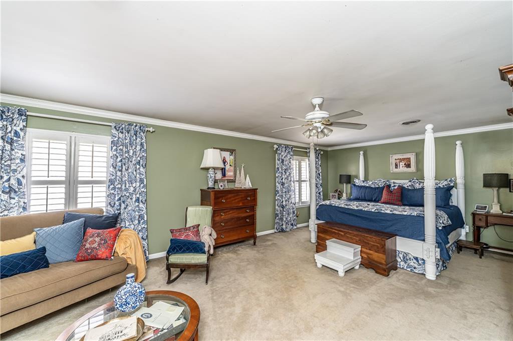 36 Saddle Mountain Road Southeast Rome, GA 30161 - Photo 32 of 42 a living room with furniture and a chandelier
