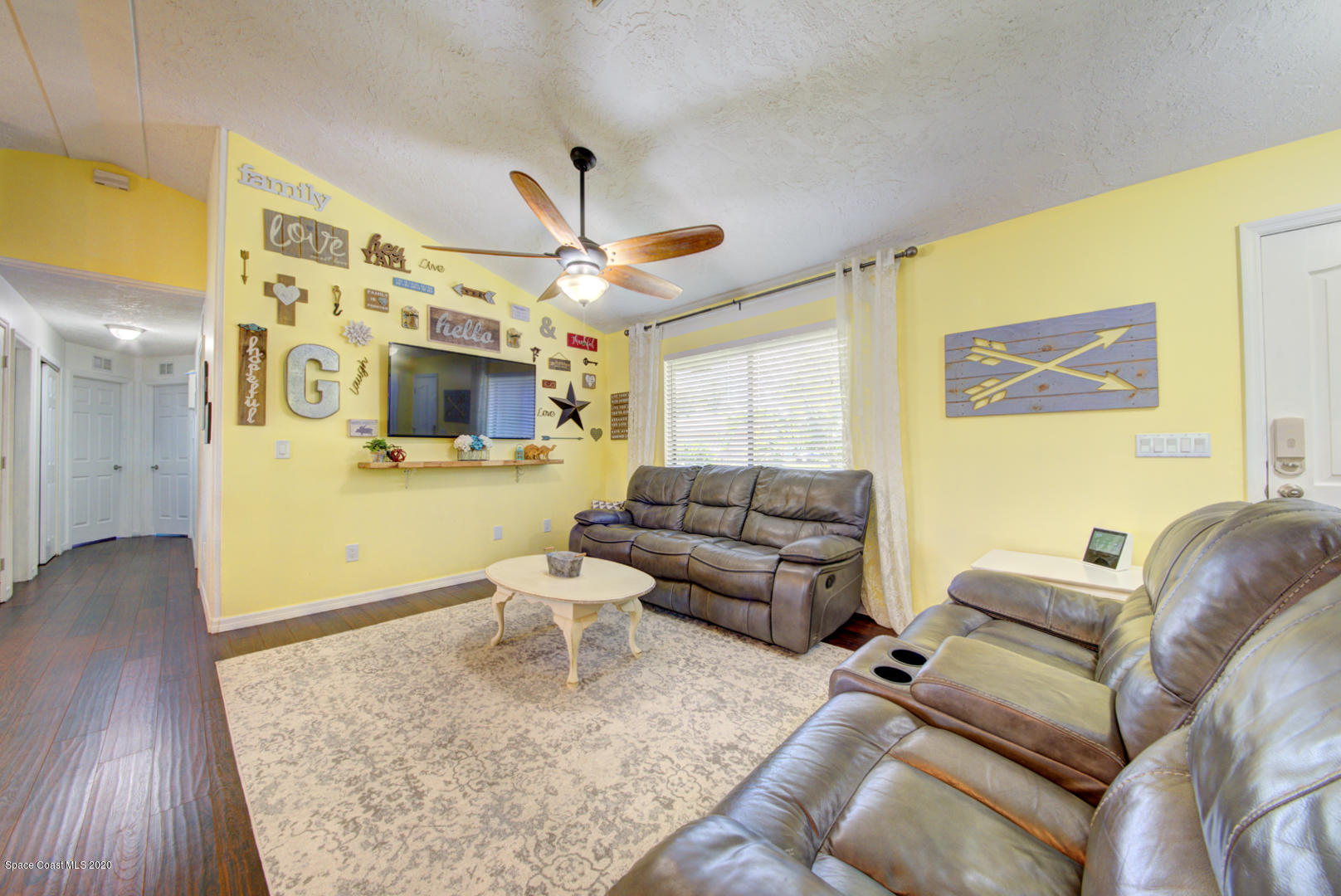 6421 Hunt Road Cocoa, FL 32927 - Photo 14 of 64 living room with fan