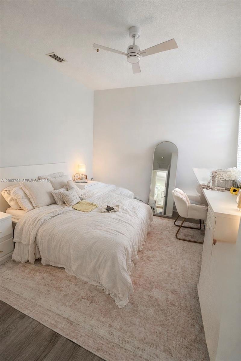 556 North West 39th Circle Boca Raton, FL 33431 - Photo 14 of 19 a bedroom with a bed and with furniture