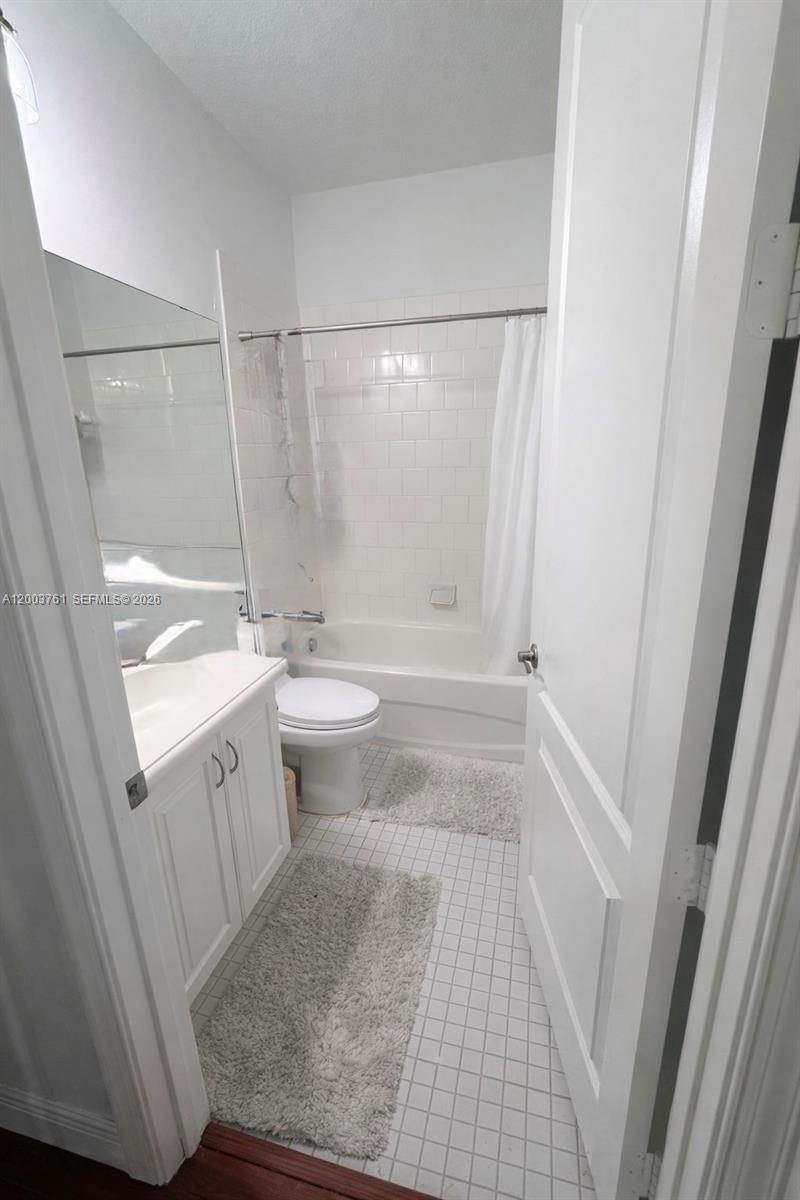 556 North West 39th Circle Boca Raton, FL 33431 - Photo 17 of 19 a bathroom with a sink a toilet and shower