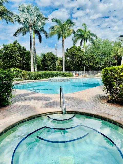 556 North West 39th Circle Boca Raton, FL 33431 - Photo 3 of 19 a view of a garden with palm trees