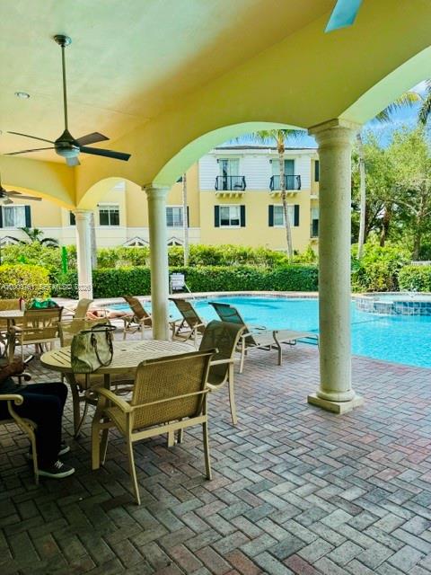 556 North West 39th Circle Boca Raton, FL 33431 - Photo 4 of 19 a view of a patio with a dining table and chairs