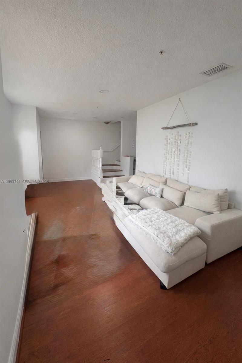 556 North West 39th Circle Boca Raton, FL 33431 - Photo 5 of 19 a living room with furniture and a table