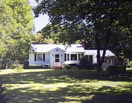 115 Reed Street Lexington, MA 02421 - Photo 1 of 1 a front view of a house with a big yard and large trees