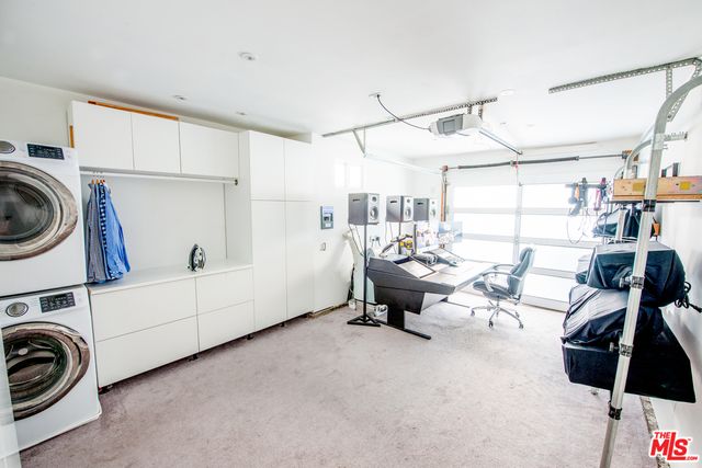 a view of a storage & utility room with racks on the wall