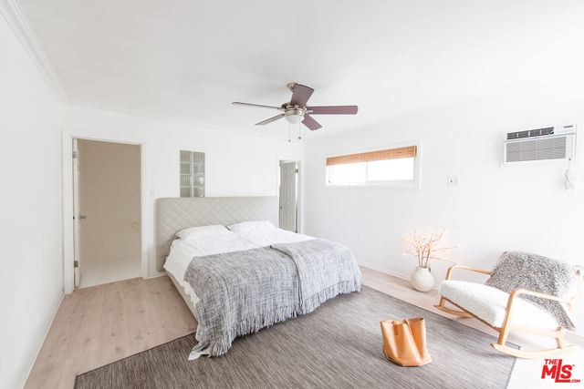 a bedroom with bed and a couch