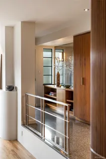 a room with wooden floor and windows