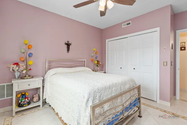 a spacious bedroom with a bed and a window