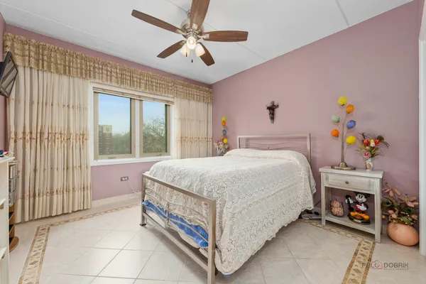 a room with furniture a baby bed and dresser