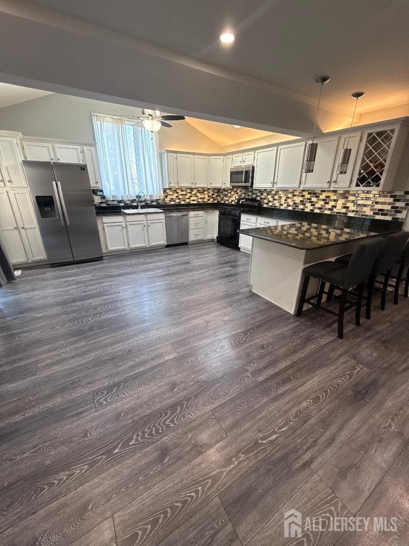 4 Davids Lane Howell, NJ 07731 - Photo 14 of 21 a large room with lots of wooden furniture