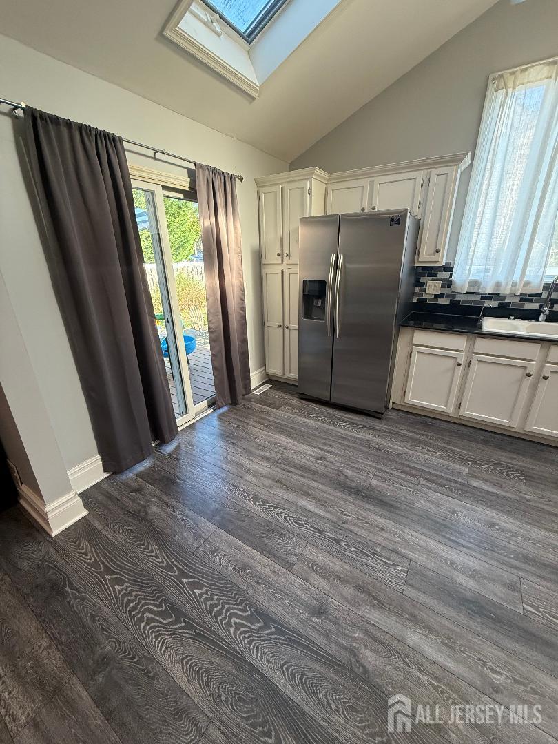 4 Davids Lane Howell, NJ 07731 - Photo 16 of 21 a view of a kitchen with wooden floor and electronic appliances