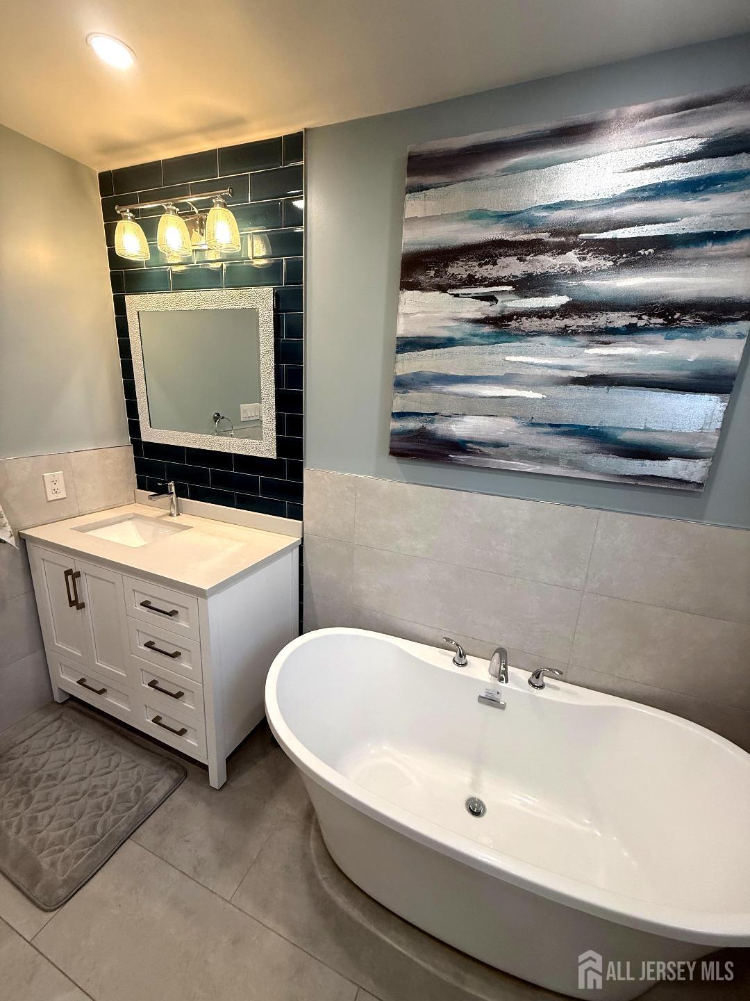 4 Davids Lane Howell, NJ 07731 - Photo 19 of 21 a bathroom with a sink and a mirror