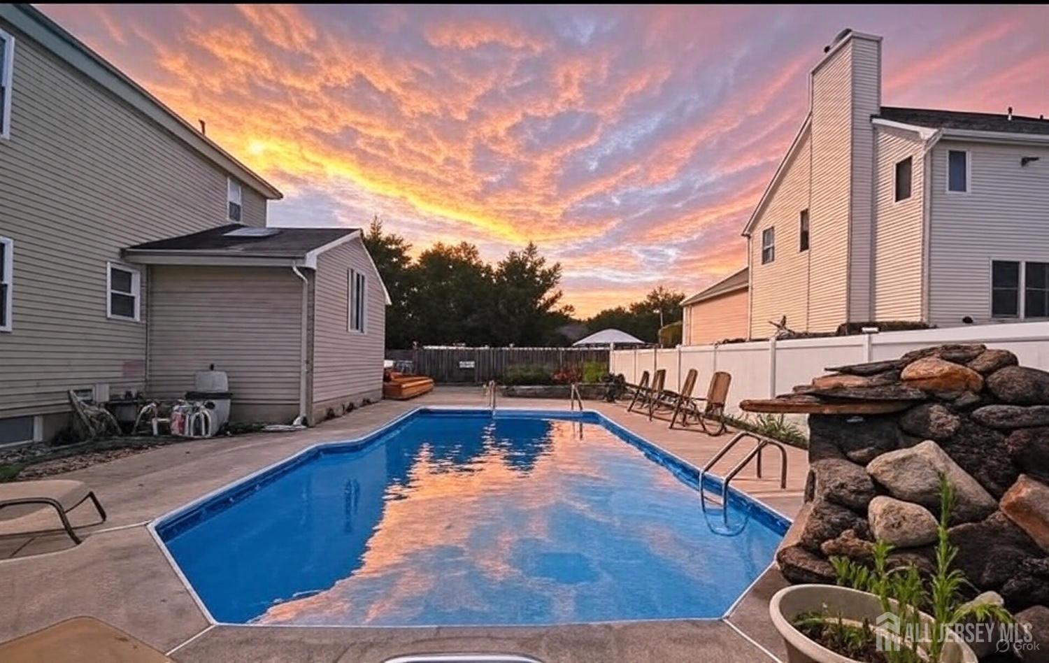 4 Davids Lane Howell, NJ 07731 - Photo 3 of 21 a swimming pool with outdoor seating
