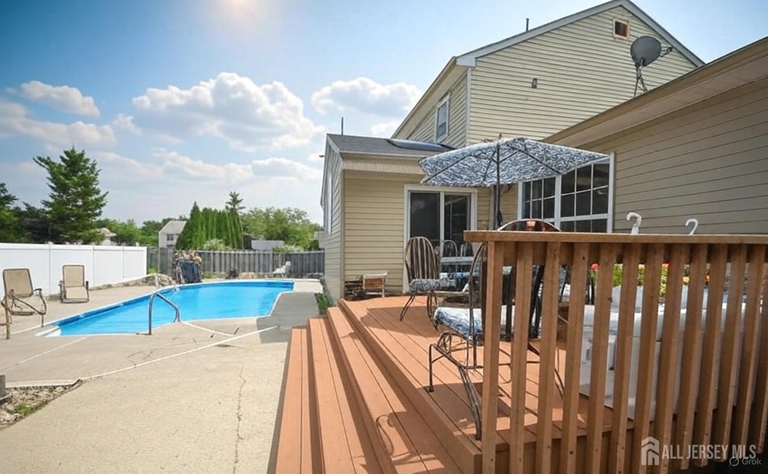 4 Davids Lane Howell, NJ 07731 - Photo 4 of 21 a view of a house with pool and chairs