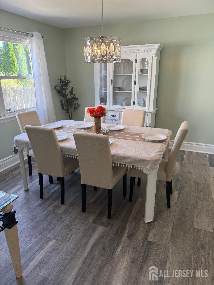 4 Davids Lane Howell, NJ 07731 - Photo 9 of 21 a view of a dining room with furniture window and wooden floor