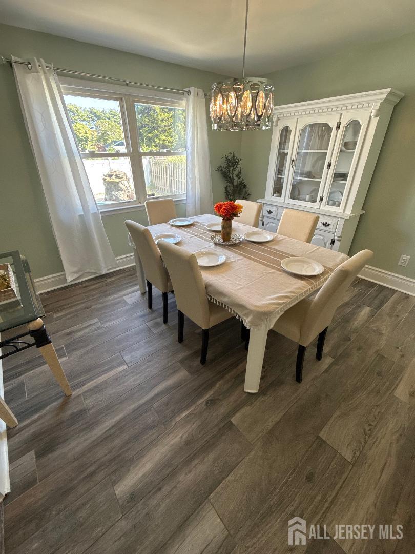 4 Davids Lane Howell, NJ 07731 - Photo 10 of 21 a view of a dining room with furniture window and wooden floor