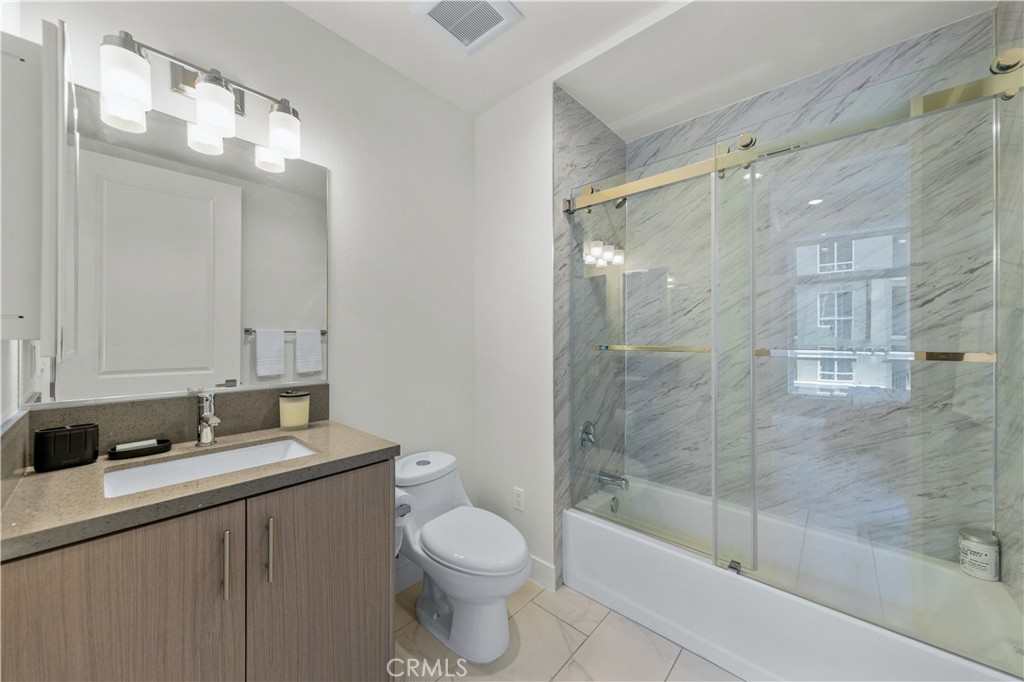 168 South Monterey Street, Unit 410 Alhambra, CA 91801 - Photo 27 of 27 a bathroom with a bathtub shower sink vanity and toilet