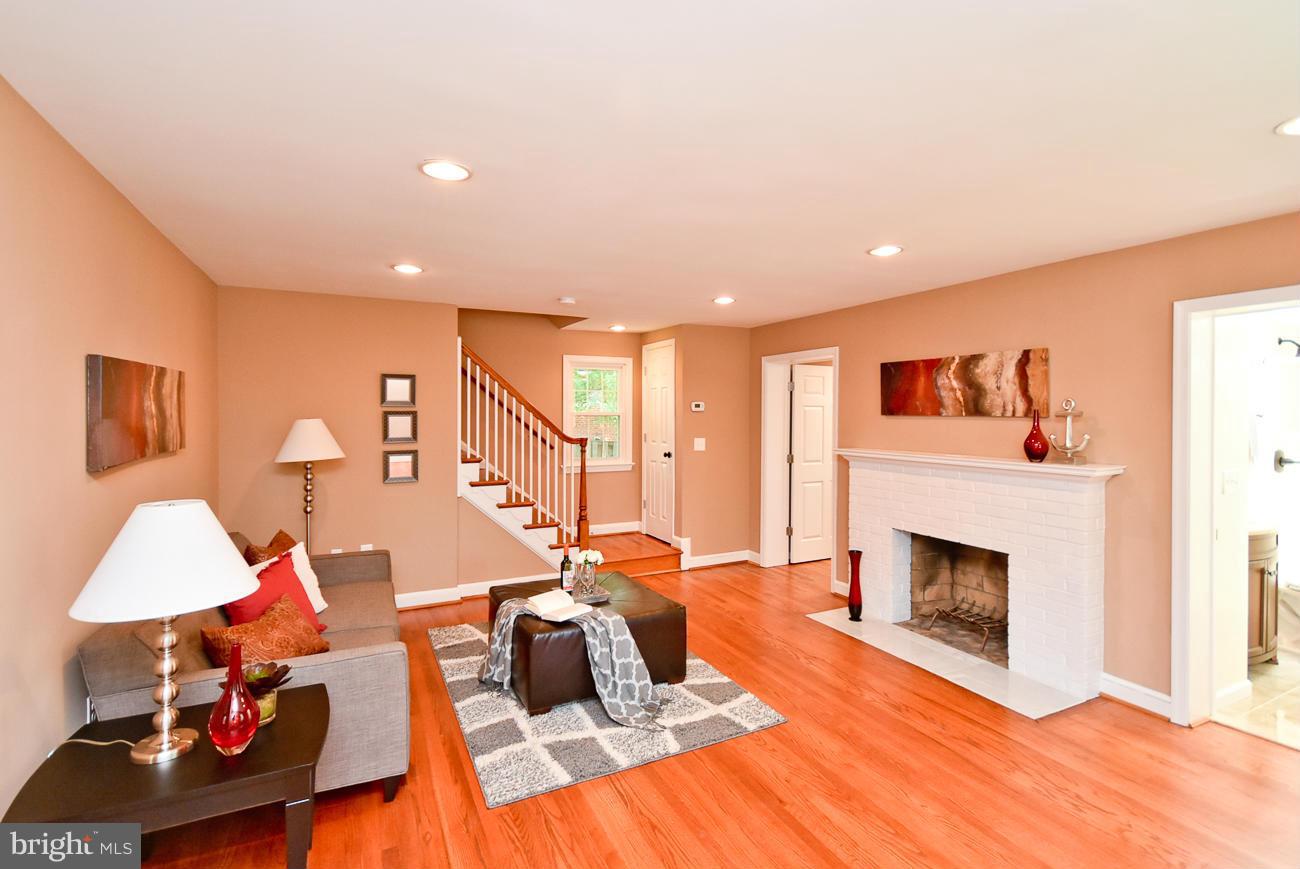 5900 Grayson Street Springfield, VA 22150 - Photo 1 of 30 a living room with furniture and a fireplace