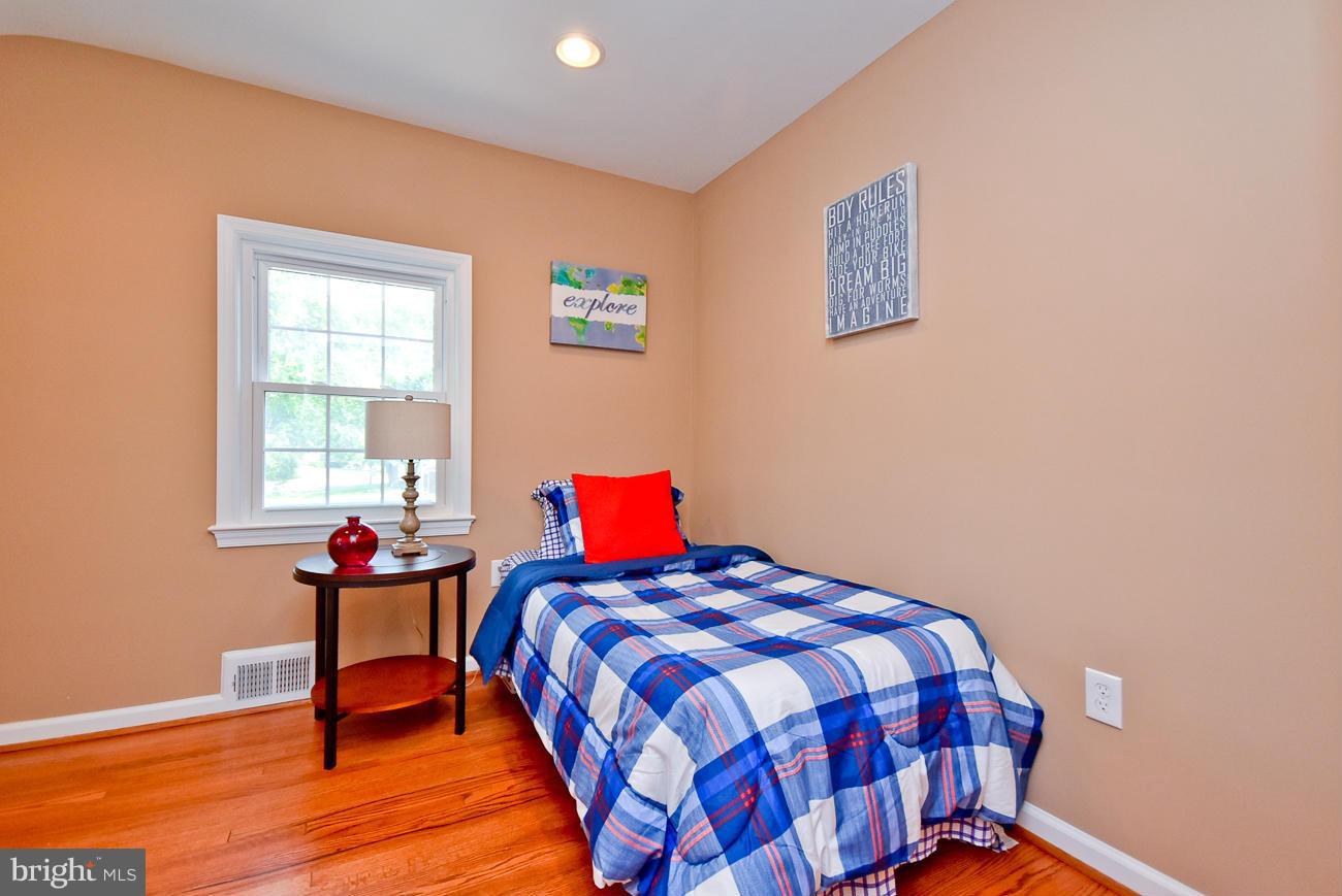 5900 Grayson Street Springfield, VA 22150 - Photo 17 of 30 a bedroom with a bed and a window