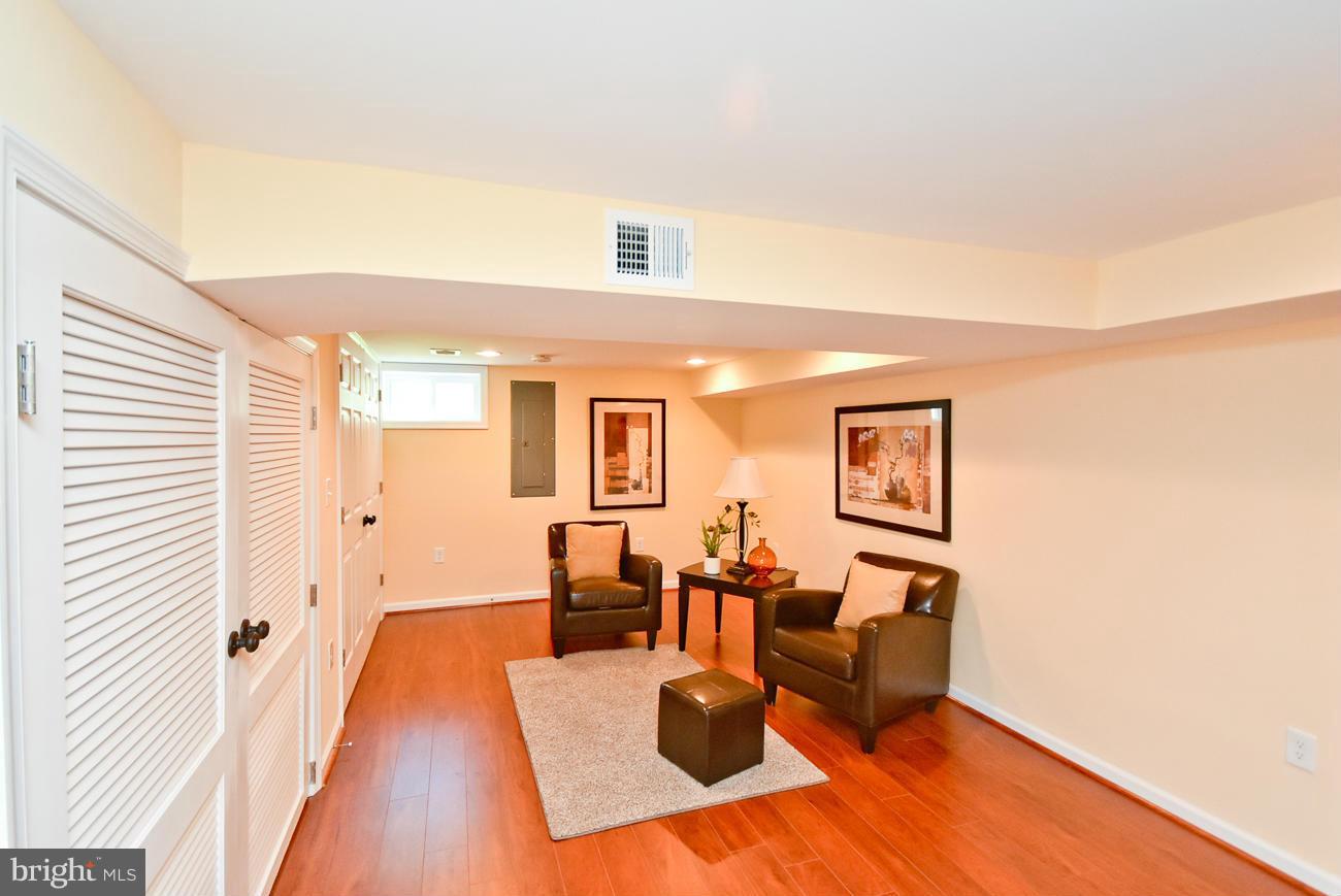 5900 Grayson Street Springfield, VA 22150 - Photo 22 of 30 a living room with furniture and a wooden floor