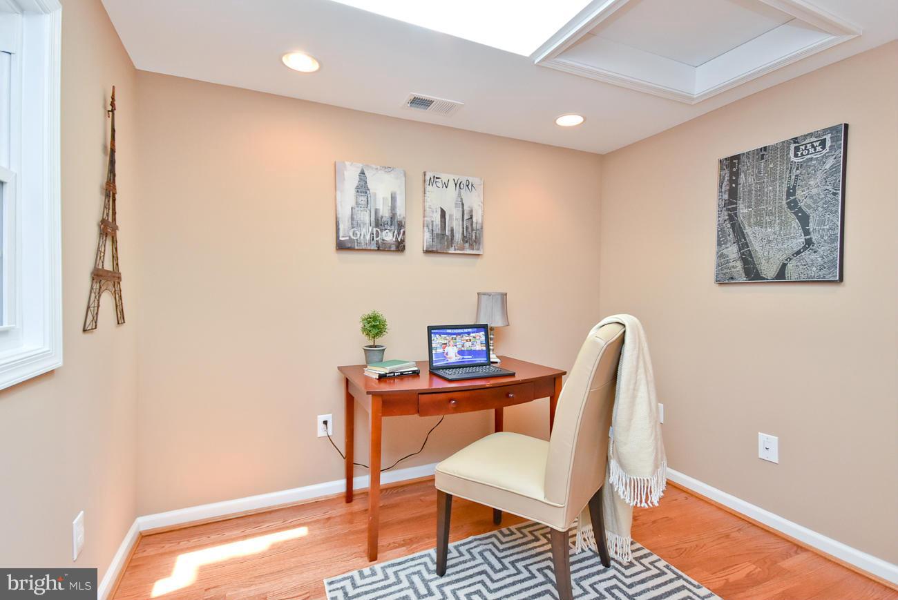 5900 Grayson Street Springfield, VA 22150 - Photo 7 of 30 a workspace with furniture and lamp