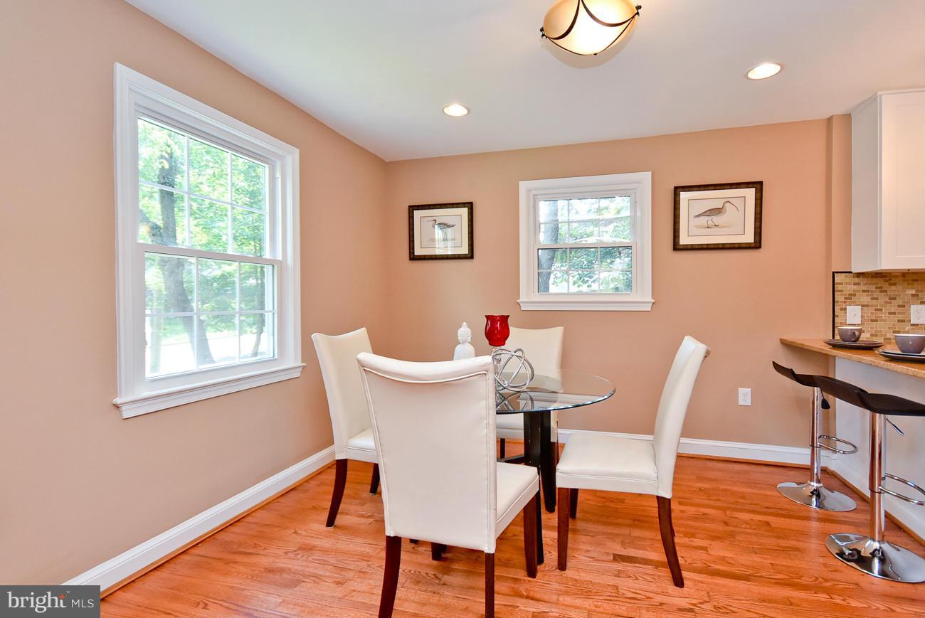 5900 Grayson Street Springfield, VA 22150 - Photo 8 of 30 a view of a dining room with furniture window and wooden floor