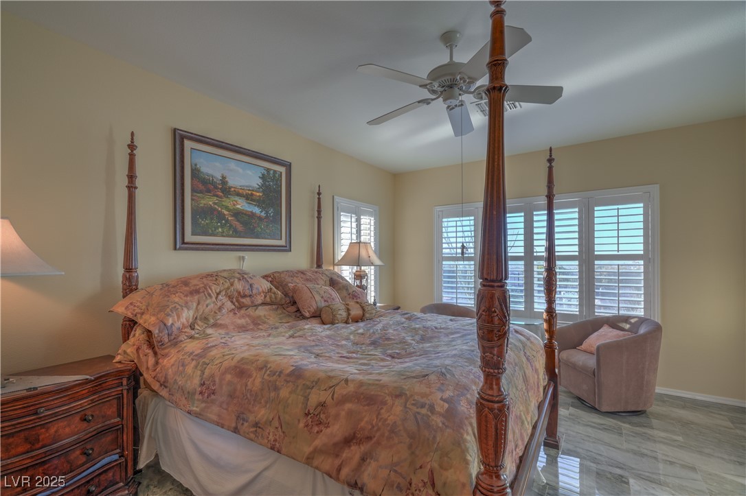 3002 Hickory Valley Road Henderson, NV 89052 - Photo 18 of 58 OWNER’S SUITE WITH DOUBLE DOOR ENTRY,
CEILING FAN, WALK-IN CLOSET, AND BATHROOM
WITH GRANITE COUNTERTOP, DUAL SINKS,
GARDEN TUB, AND LARGE SHOWER W/SEAT