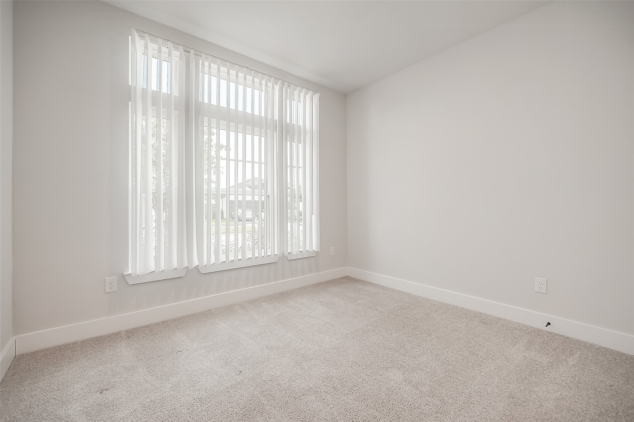 29022 Laurel Grove Lane Fulshear, TX 77441 - Photo 17 of 42 an empty room with a window