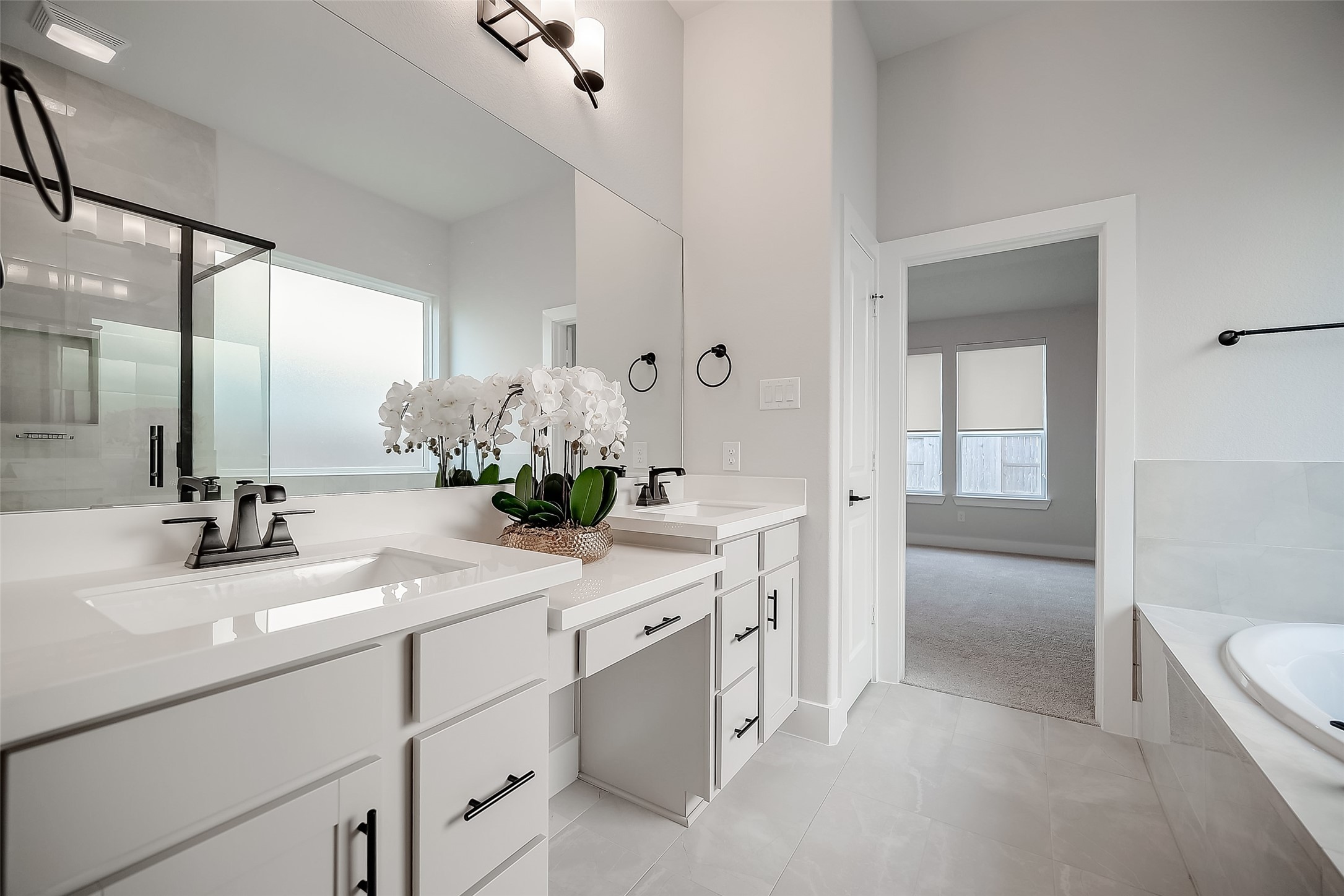 29022 Laurel Grove Lane Fulshear, TX 77441 - Photo 22 of 42 a bathroom with a sink and a mirror