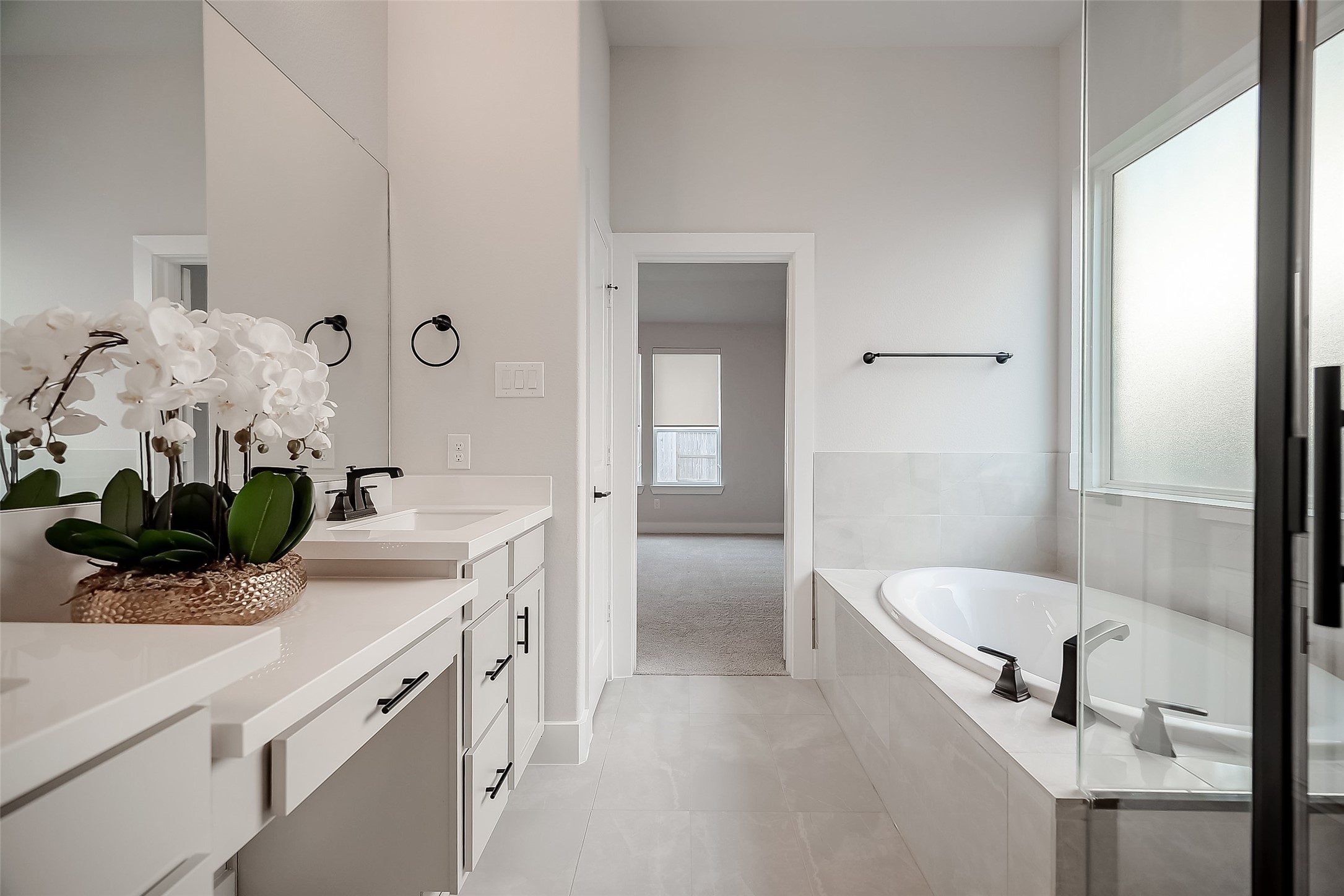29022 Laurel Grove Lane Fulshear, TX 77441 - Photo 23 of 42 a bathroom with a sink and a mirror