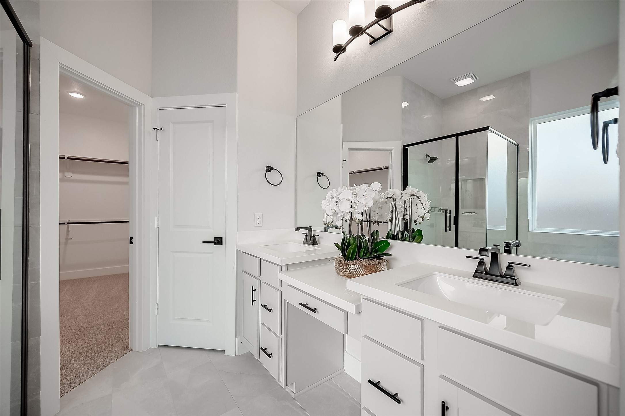 29022 Laurel Grove Lane Fulshear, TX 77441 - Photo 24 of 42 a bathroom with double vanity and a mirror