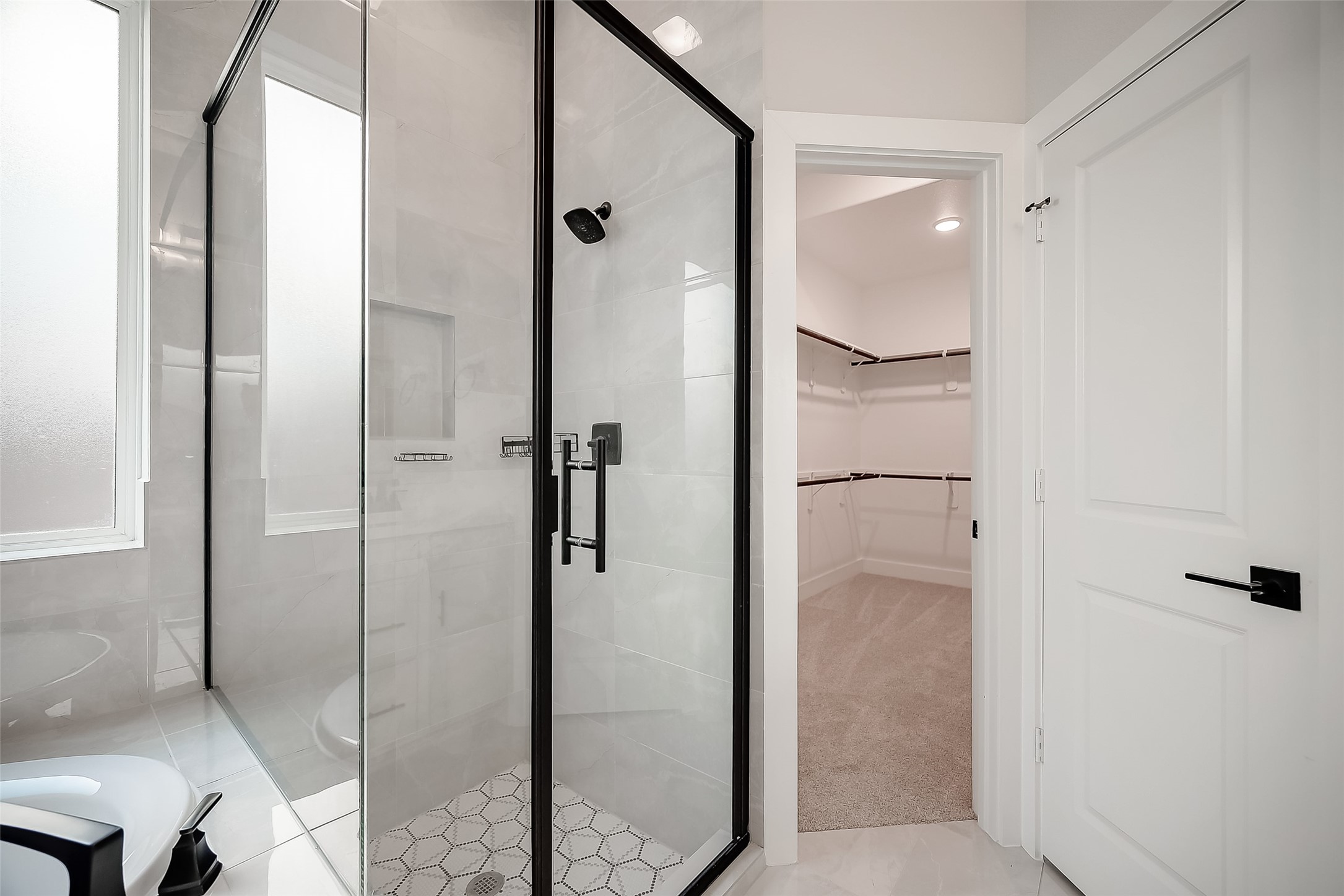 29022 Laurel Grove Lane Fulshear, TX 77441 - Photo 25 of 42 a bathroom with a shower and a glass door