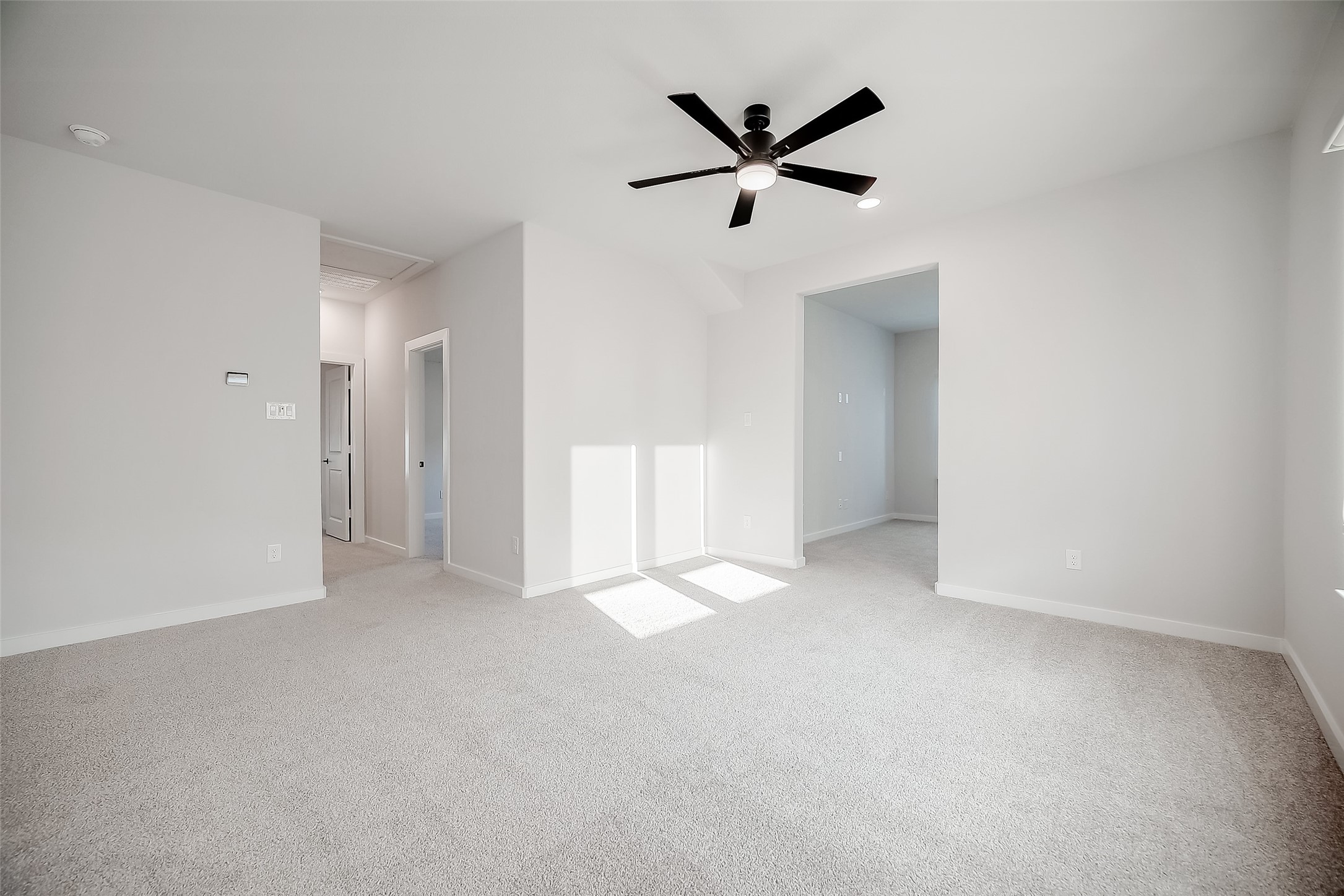 29022 Laurel Grove Lane Fulshear, TX 77441 - Photo 28 of 42 an empty room with ceiling fan and window