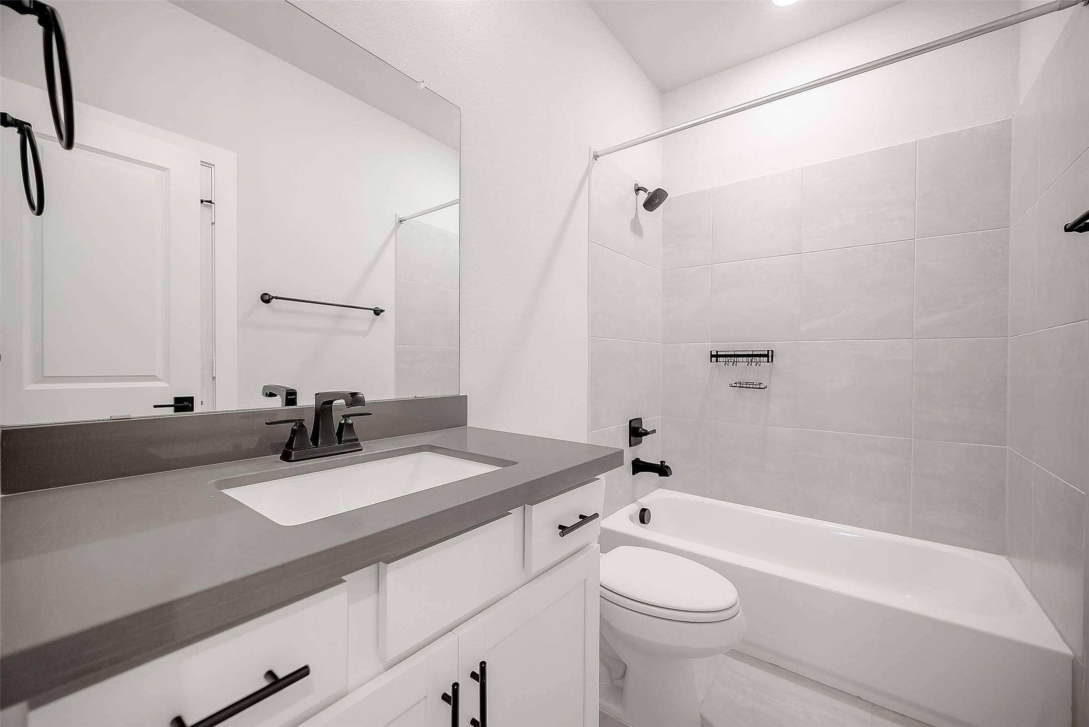 29022 Laurel Grove Lane Fulshear, TX 77441 - Photo 36 of 42 a bathroom with a sink a toilet and a mirror