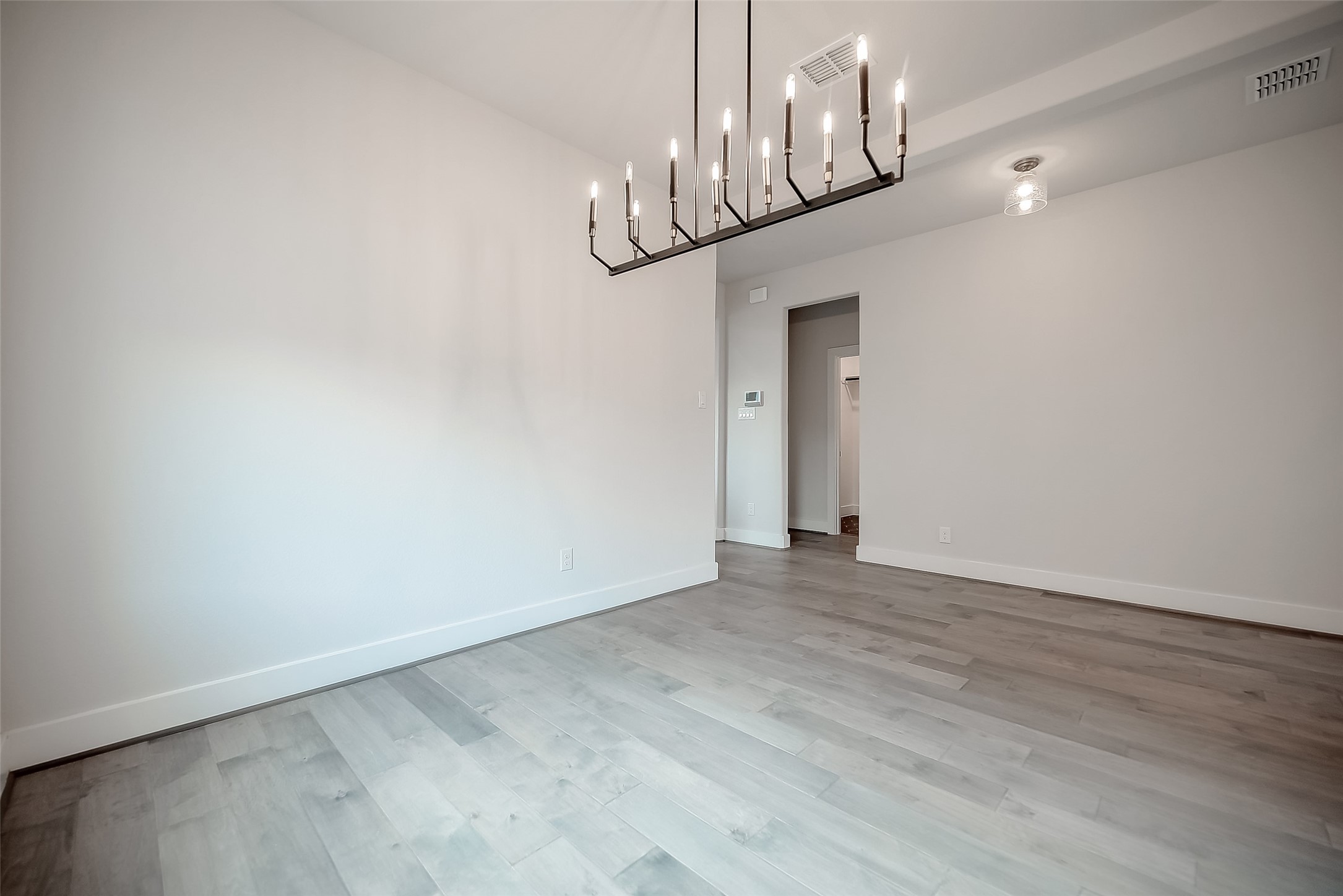29022 Laurel Grove Lane Fulshear, TX 77441 - Photo 6 of 42 a view of an empty room with wooden floor