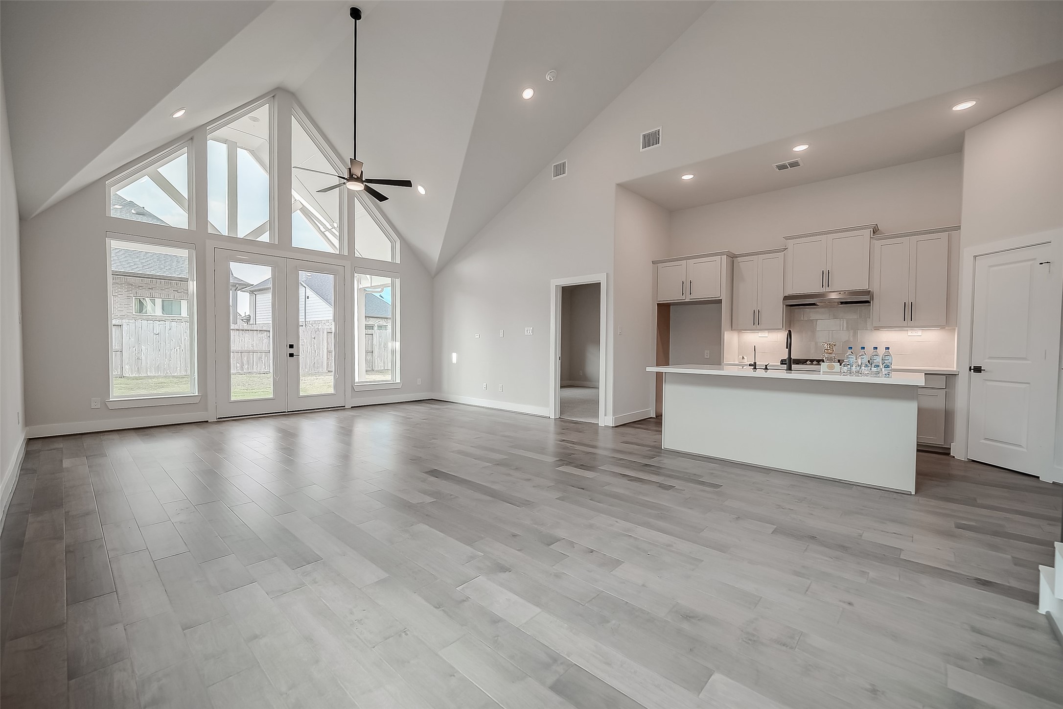 29022 Laurel Grove Lane Fulshear, TX 77441 - Photo 8 of 42 a view of a kitchen with a sink and wooden floor