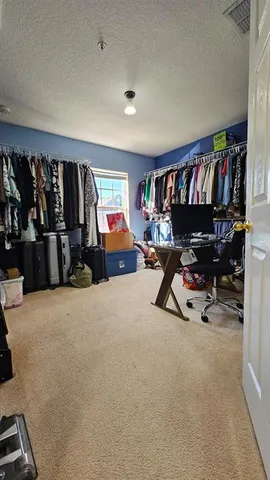 a view of a livingroom with furniture and toys