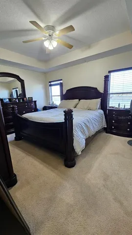 a bedroom with bed and a window