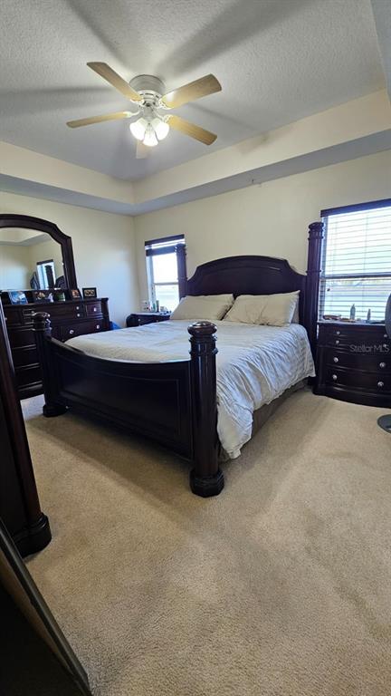 10193 Ridgebloom Avenue Orlando, FL 32829 - Photo 18 of 41 a bedroom with bed and a window