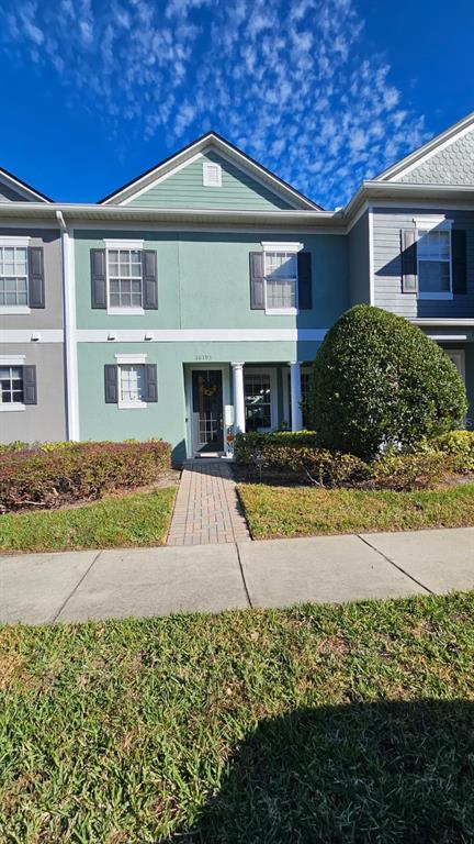 10193 Ridgebloom Avenue Orlando, FL 32829 - Photo 2 of 41 a front view of a house with garden