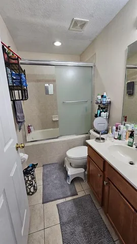a bathroom with a bathtub sink and toilet